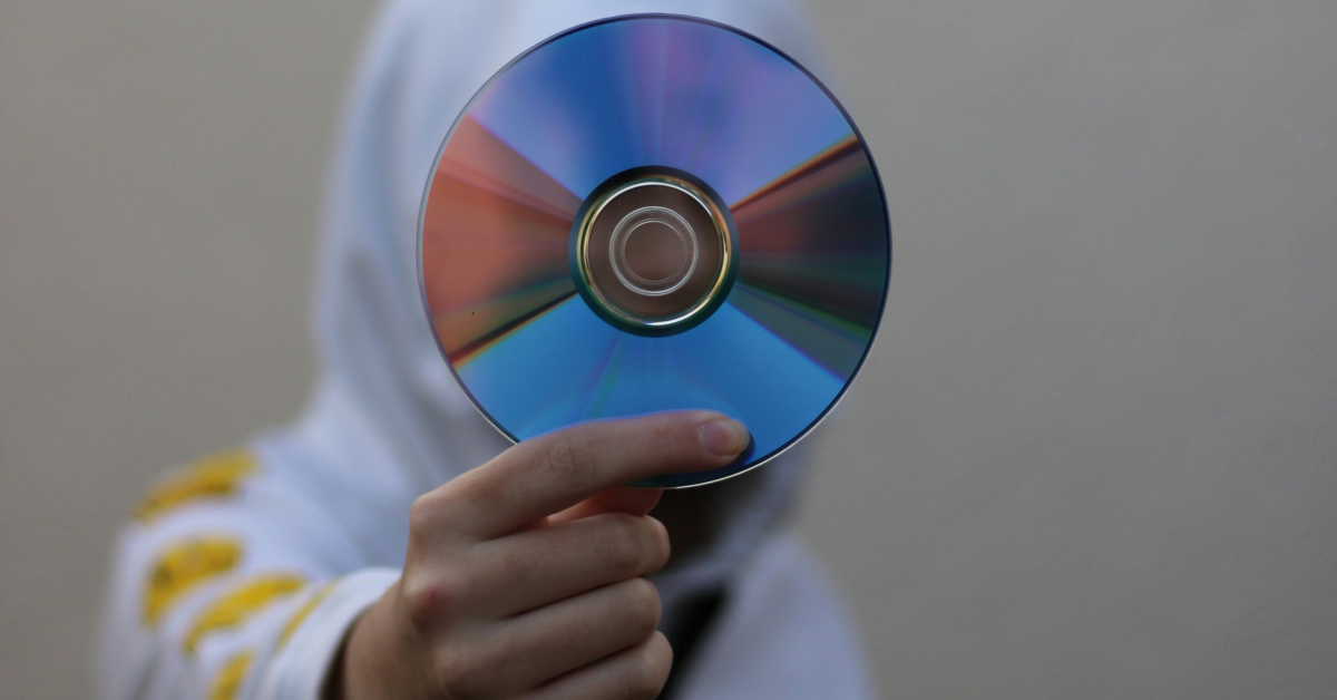 Holding a CD Unsplash